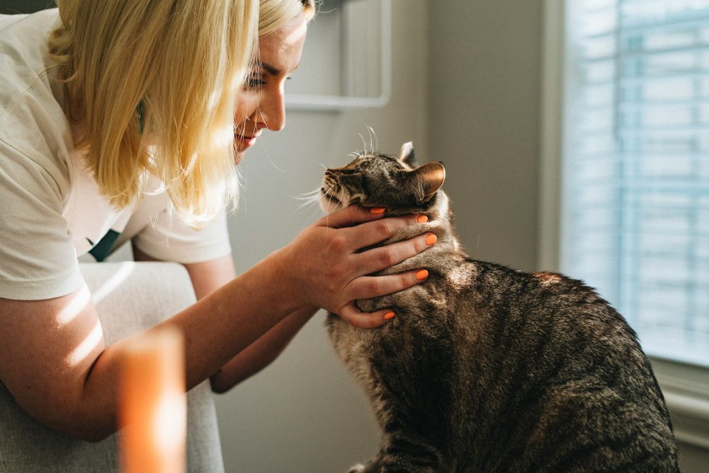 A photo of a lady with her cat